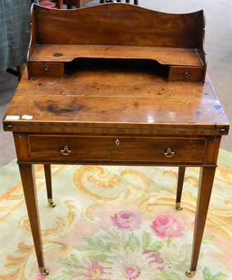 Lot 1433 - A George III mahogany writing table, early 19th century, with a super structure back, folding...