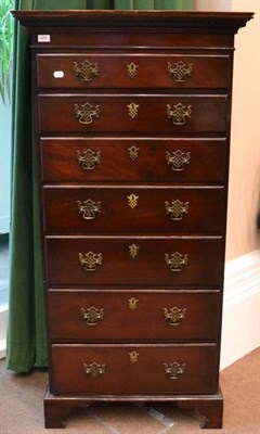 Lot 1438 - ^ A George III style mahogany straight fronted chest of drawers, with a Greek key cornice above...