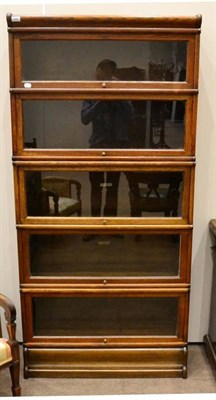 Lot 1440 - A Globe-Wernicke & Co Ltd oak five sectional bookcase, with glazed pivoting doors, 181cm high