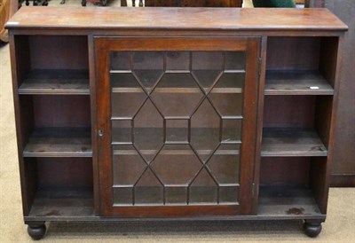 Lot 1442 - ^ A late 19th century mahogany dwarf bookcase, with central astragal glazed door flanked by...