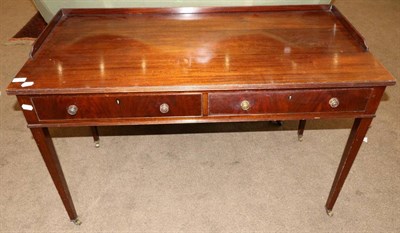 Lot 1443 - A late 19th century mahogany two drawer writing desk/dressing table, with two frieze drawers...