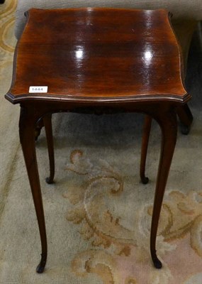 Lot 1444 - A late 19th century rosewood occasional/lamp table of serpentine shaped form, raised on slender...