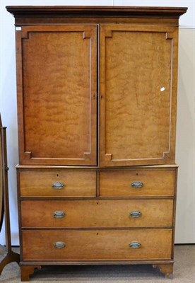 Lot 1446 - A late George III linen press, early 19th century, with two cupboard doors enclosing five pine...