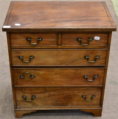 Lot 1451 - ^ A mahogany and ebony strung chest of small proportions with two short over three long...