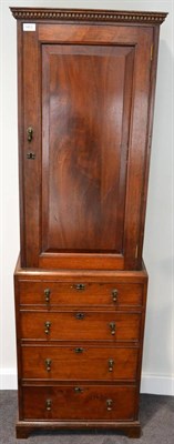 Lot 1453 - ^ A mahogany cabinet on chest, part 18th century and adapted, the dentil cornice above a...