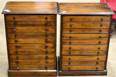 Lot 1458 - A pair of Victorian stained pine collectors cabinets, each with ten drawers raised on a plinth...