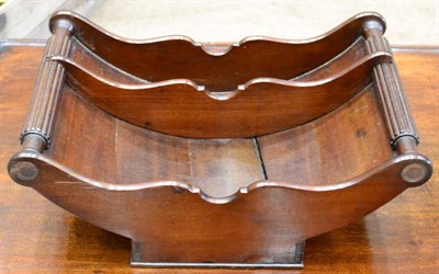 Lot 1461 - A Regency mahogany cheese coaster, early 19th century, with reeded handles, shaped divider,...