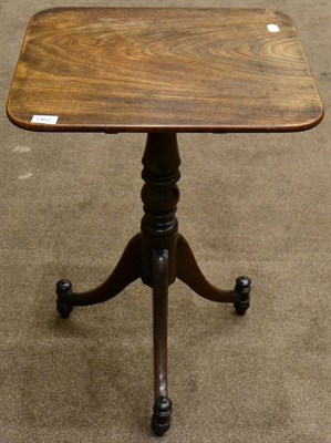 Lot 1462 - ^ A Regency mahogany flip-top tripod table raised on turned varsey formed support with three...