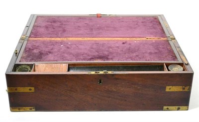 Lot 1474 - A Victorian mahogany and brass bound writing slope, mid 19th century, with hinged lid enclosing...