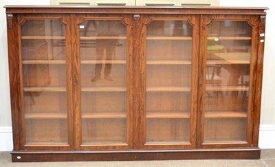 Lot 1481 - A Victorian mahogany four door bookcase, with glazed doors enclosing eight adjustable shelves,...