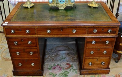 Lot 1483 - A Victorian mahogany pedestal desk, third quarter 19th century, with a green leather writing...