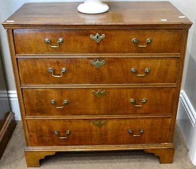 Lot 1494 - An 18th century walnut and pine sided four drawer chest, with four feather banded cross-banded...