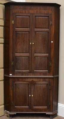 Lot 1497 - ^ An imposing George III mahogany free-standing corner cabinet, circa 1800, the upper section...