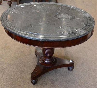 Lot 1501 - A mahogany centre table, 2nd quarter 19th century, a circular grey moulded marble top, raised...