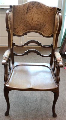 Lot 1522 - A 19th century mahogany wing armchair, labelled from Jas Shoolbred & Co, Tottenham Court Road,...