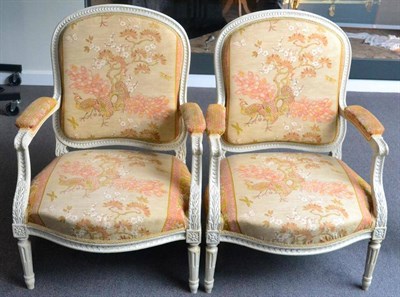 Lot 1526 - A Pair of 19th century cream pained fauteuille chairs, carved frames, re-upholstered, Oriental...