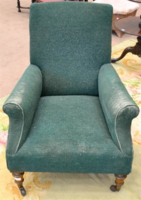 Lot 1533 - ^ A Victorian armchair recovered in green moquette, raised on turned forelegs with brass capped...