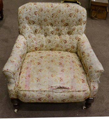 Lot 1539 - A Victorian nursing chair, circa 1870, the button back with an overstuffed seat, raised on...