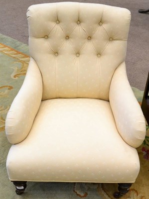 Lot 1540 - A Victorian nursing chair, circa 1860, recovered in cream button back floral fabric, raised on...