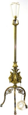 Lot 1562 - A late 19th/early 20th century adjustable standard lamp with a reeded column and leaf cast...