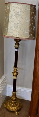 Lot 1563 - ^ A carved gilt wood standard lamp, late 19th / early 20th century, with pink velvet...