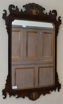 Lot 1565 - ^ A George III style mahogany and parcel gilt pier glass with carved pediment and plume centred...