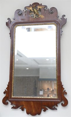 Lot 1566 - A George III style mahogany and parcel gilt pier glass with decorative plume as a ho-ho bird,...