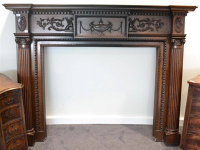 Lot 1567 - A late 19th century carved mahogany mantelpiece in Adam style, of breakfront form, the acorn...