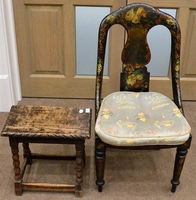 Lot 1574 - ^ A Victorian ebonised and papier-mache chair, painted overall with flowers, caned feet and...