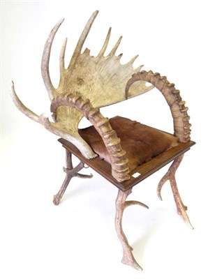 Lot 1581 - An Austro-German antler and horn mounted armchair, circa 20th century, made from a single moose...