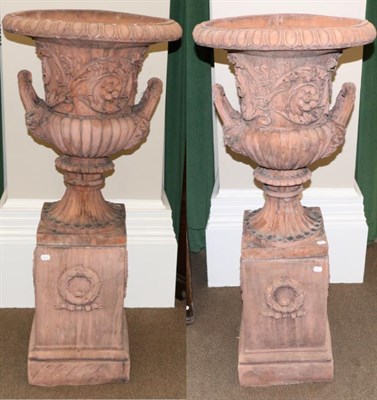 Lot 1597 - A pair of terracotta style campana shaped garden urns of recent date, the acanthus and...