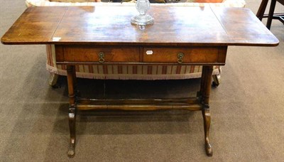 Lot 1603 - A 1920/30's walnut sofa table in the George III style, drop leaves above two drawers, raised on...