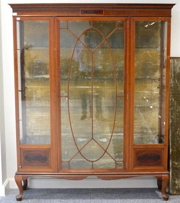 Lot 1610 - Edwardian mahogany and satinwood banded display cabinet, circa 1900, the glazed door enclosing...