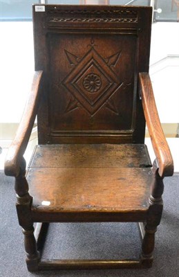 Lot 1640 - A joined oak armchair, circa 1700, the carved top rail above a lozenge carved back support with...