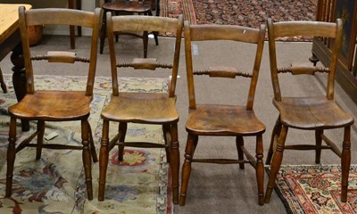 Lot 1652 - A set of four 19th century fruit wood and elm kitchen chairs, stamped JP & MC, raised on...