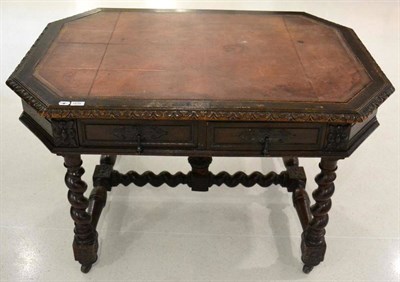 Lot 1656 - A Victorian carved oak writing desk or centre table, circa 1880, of octagonal shaped form,...