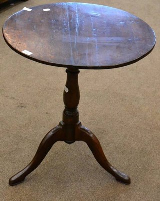 Lot 1665 - An 18th century oak bird cage tripod table, with circular top, raised on a turned varsey form...