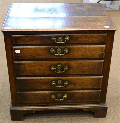 Lot 1671 - An 18th century oak straight fronted chest of drawers, with five graduated drawers, raised on...