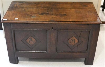 Lot 1675 - An early 18th century joined oak chest, the later boarded lid above fielded panels with...