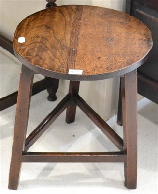 Lot 1679 - An early 19th century cricket table with circular top and three chamfered legs with triangular...