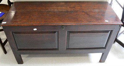 Lot 1680 - ^ An early 19th century joined oak chest, with hinged lid above two fielded panels, raised on stile