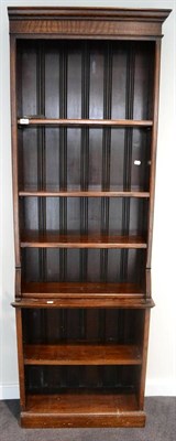 Lot 1683 - ^ An oak freestanding bookcase, late 19th/ early 20th century, with adjustable shelves, raised on a