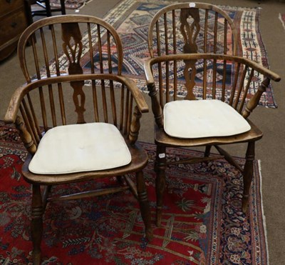 Lot 1688 - Two 19th century ash Windsor armchair, with double spindle support, moulded seat, raised on spindle