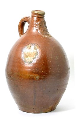 Lot 18 - A Rhenish Brown Salt Glazed Stoneware Bellarmine, 17th century, of traditional ovoid form with...