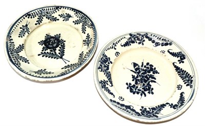 Lot 24 - A Pair of Continental Slipware Dishes, late 18th century, painted in blue with stylised flowers...