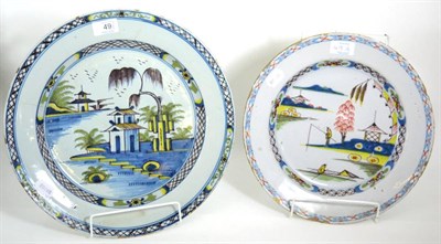 Lot 49 - An English Delft Charger, circa 1750, painted in colours with a chinoiserie scene depicting a...