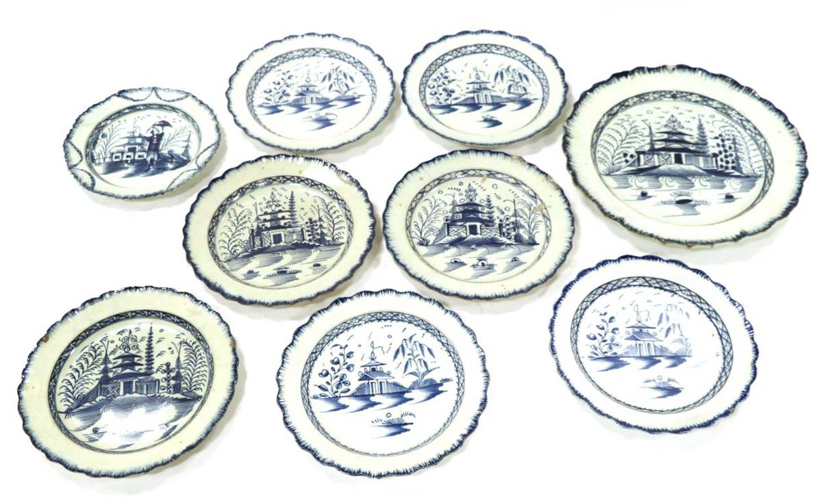 Lot 50 - A Pearlware Circular Platter, circa 1780, painted in underglaze blue with chinoiserie buildings...