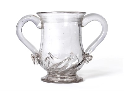 Lot 82 - A Glass Loving Cup, circa 1730, of baluster form with strap handles, reeded rim and gadrooned base