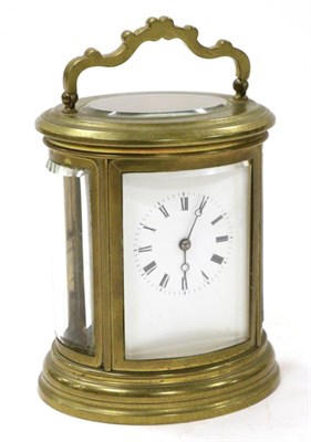 Lot 134 - A Brass Oval Striking Carriage Clock, circa 1890, carrying handle, enamel dial with Roman numerals