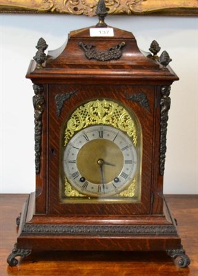 Lot 137 - An Oak Quarter Striking Mantel Clock, circa 1900, caddied pediment with acorn finials, side...